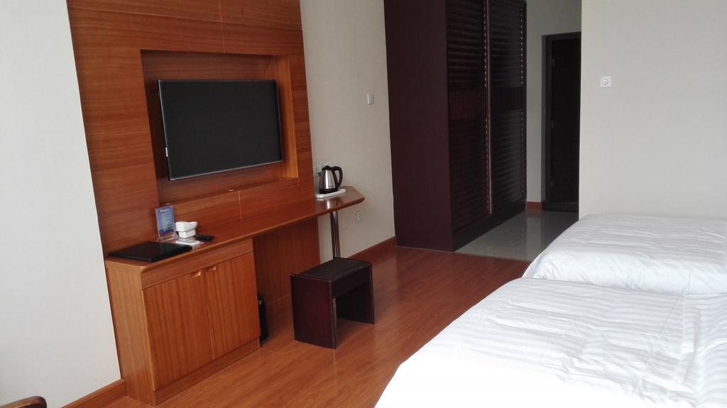 Weihai Times Business Hotel Quarto foto