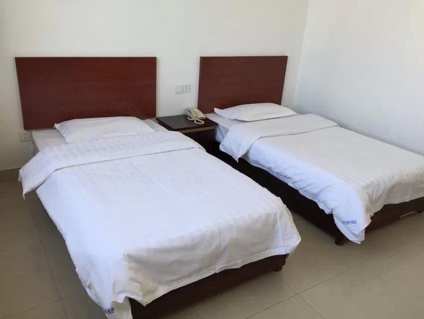 Weihai Times Business Hotel Quarto foto
